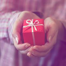 pic of hands giving gift